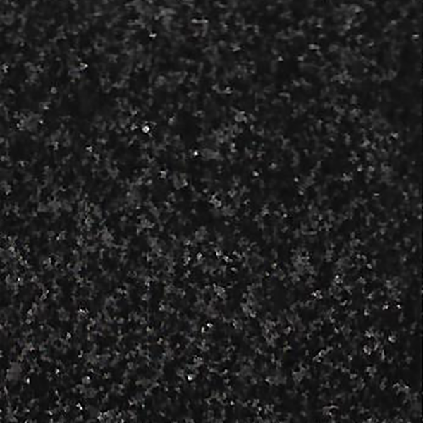 A close up of a black surface with a lot of small dots on it.