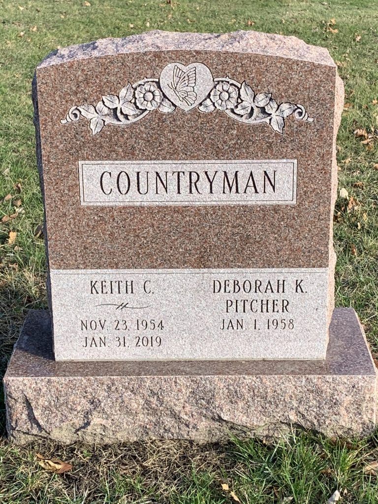 A gravestone for a man named countryman in a cemetery.