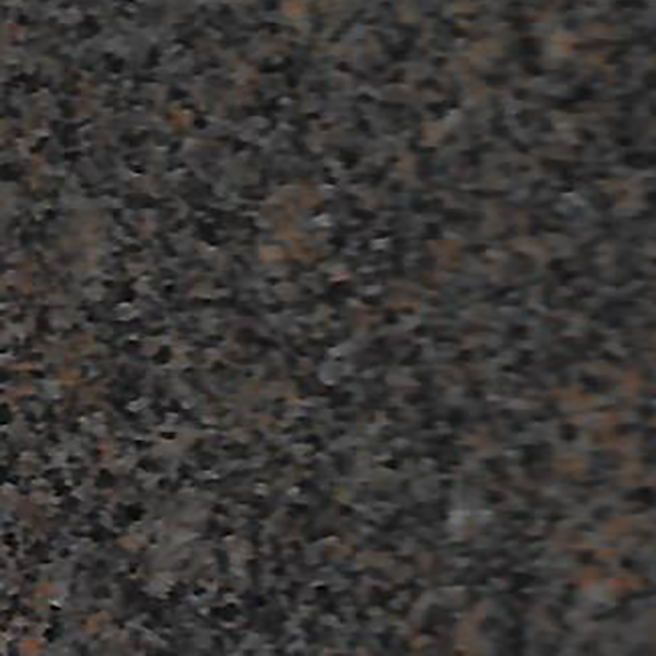 A close up of a brown granite counter top.