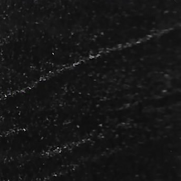 A close up of a black surface with white lines on it.