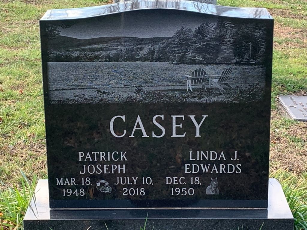 A black gravestone with the name casey on it