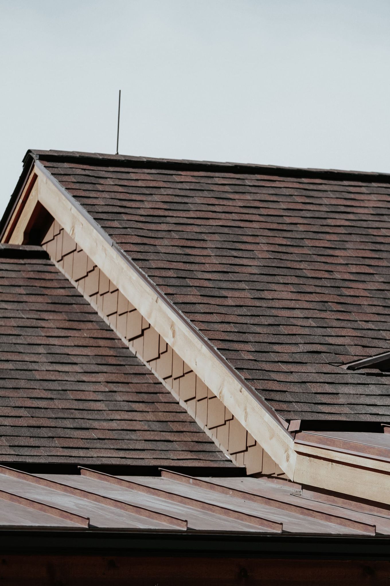 A close up of a roof with a wooden trim