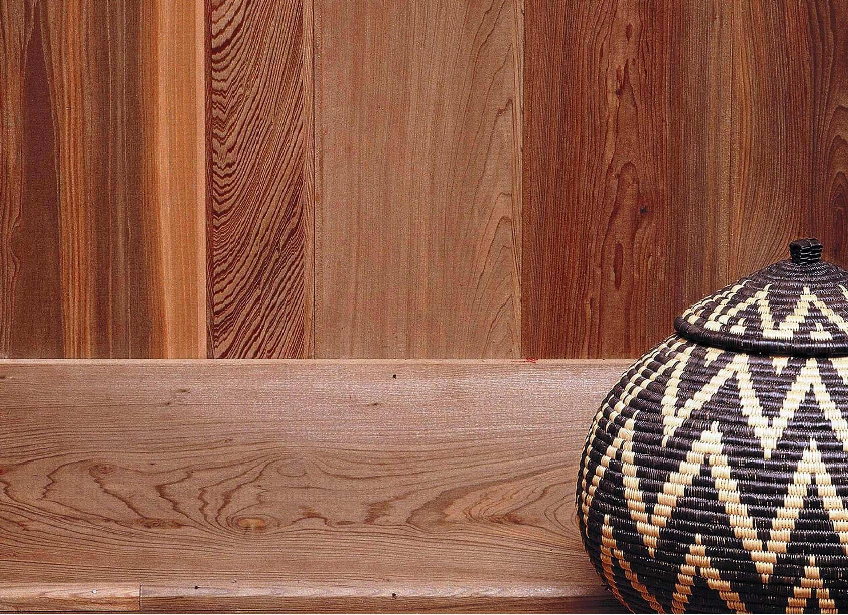 Wooden paneling with a woven basket.
