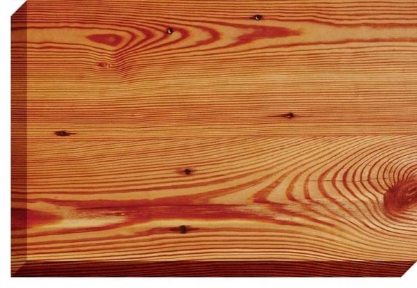 Wooden plank, reddish-brown color, visible wood grain and knots.