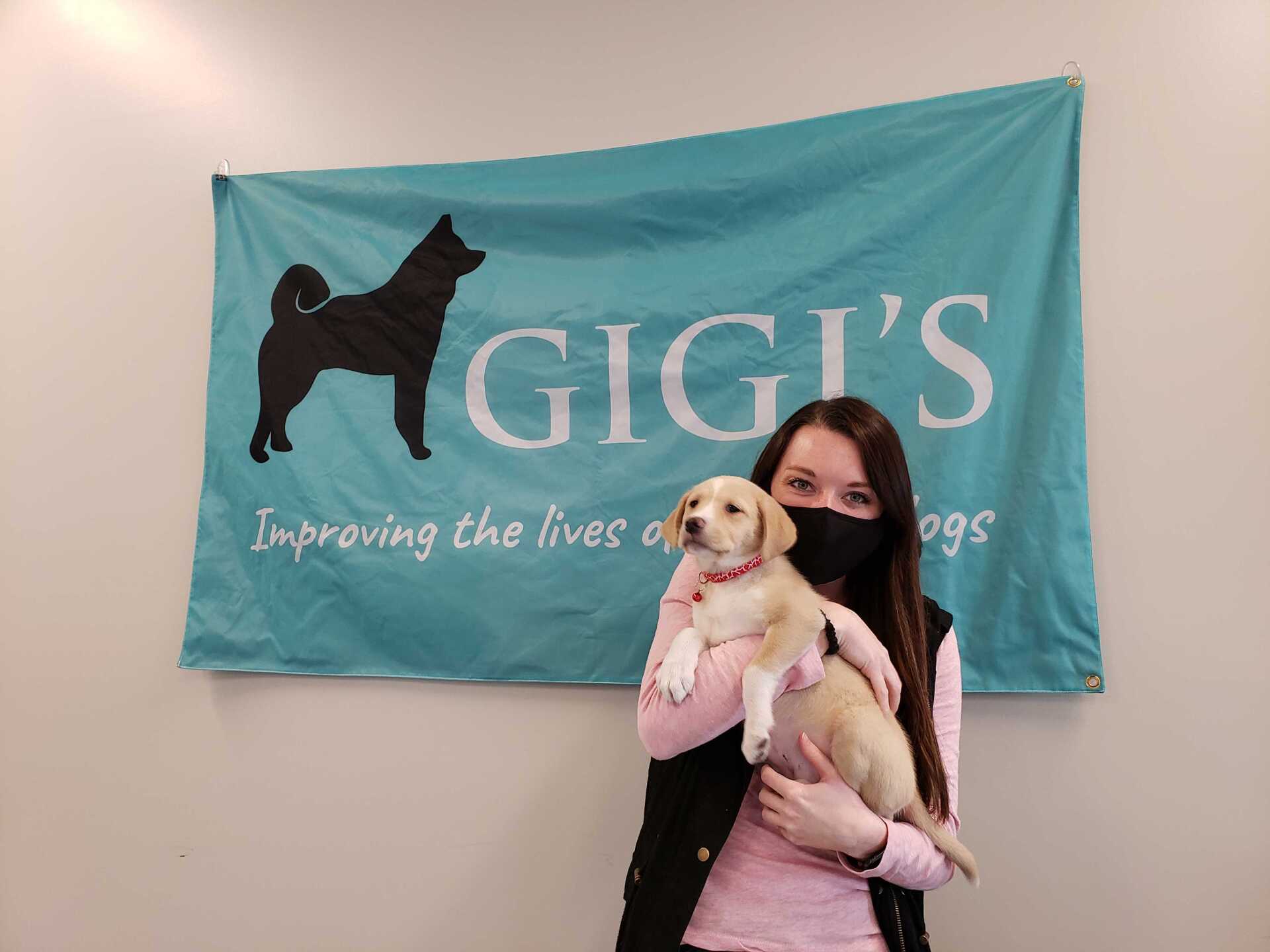 Elderly couple standing with dog in front of building | Gigi's Shelter for Dogs | Trinity In The Community  | Trinity Homes | Columbus, Ohio 43231