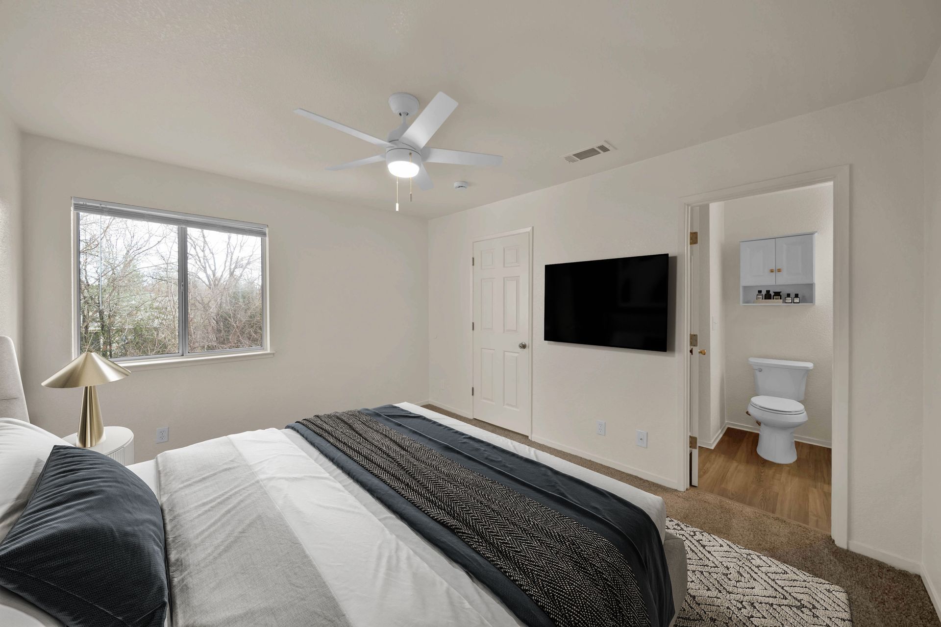 2 Bedroom, 2 Bathroom - Bedroom with ensuite bathroom and view out window.