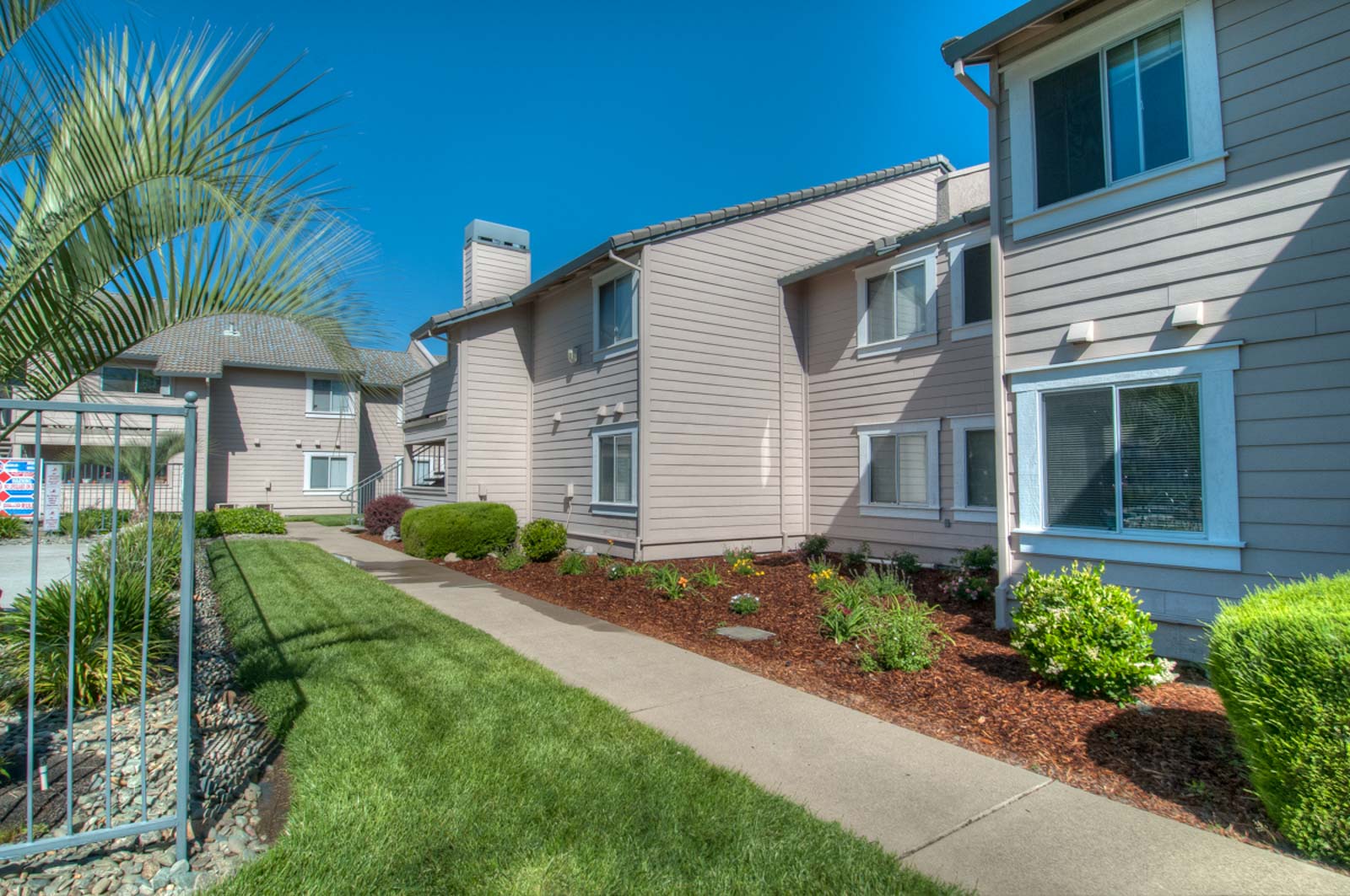 Another exterior view of the apartment complex next to the pool