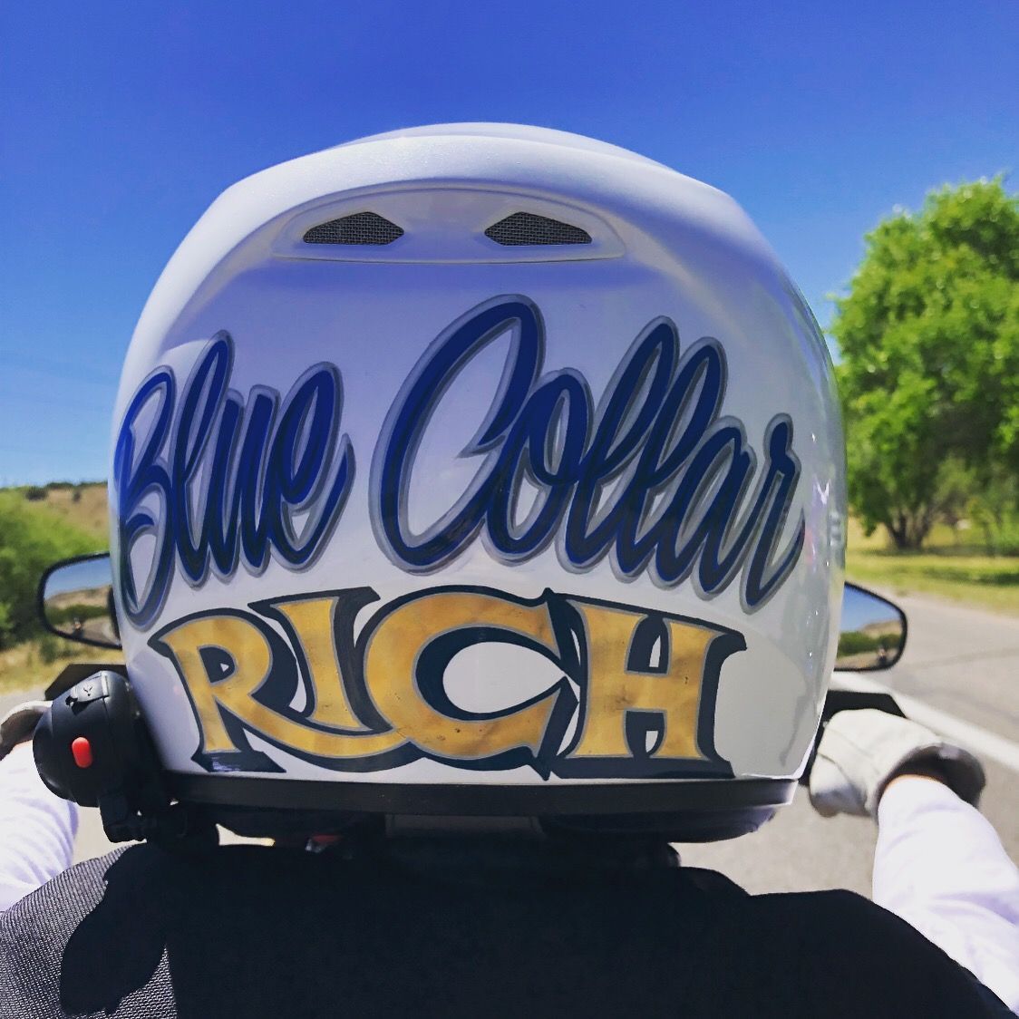 A white motorcycle helmet from behind, with 