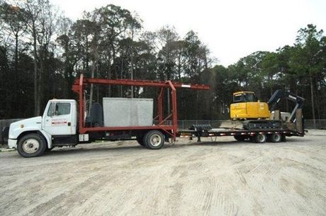 Open Trailer Truck With Large Trees — Panama City, FL — Parker Septic