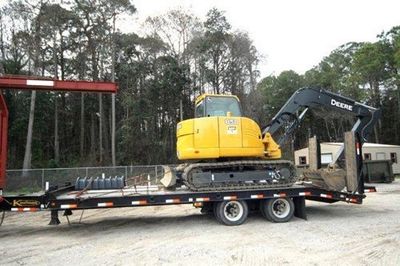 Mini Excavator On A Trailer Truck — Panama City, FL — Parker Septic