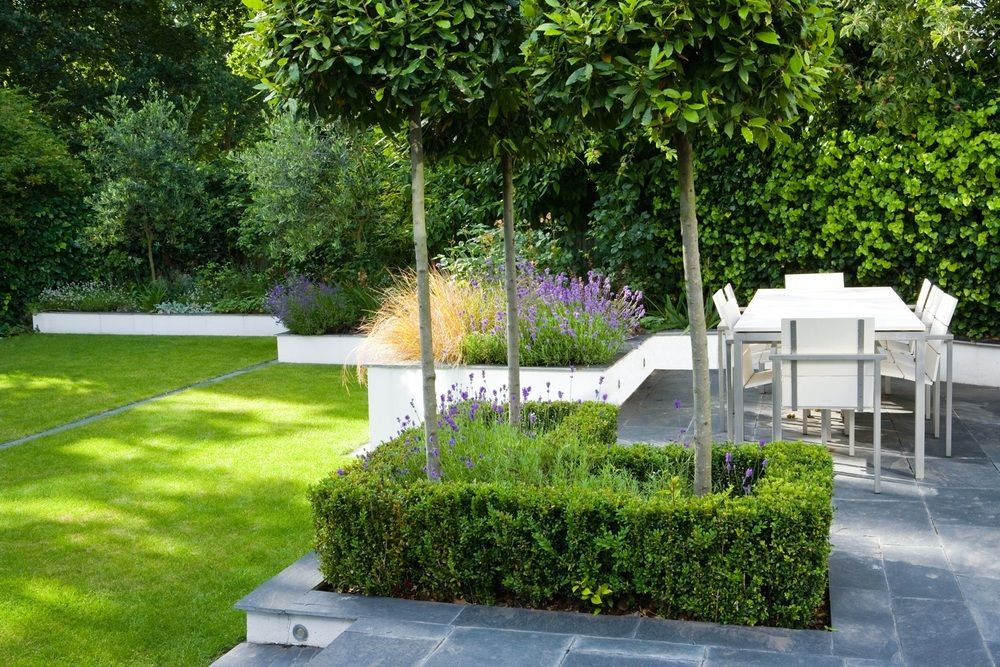 A garden with a table and chairs in it