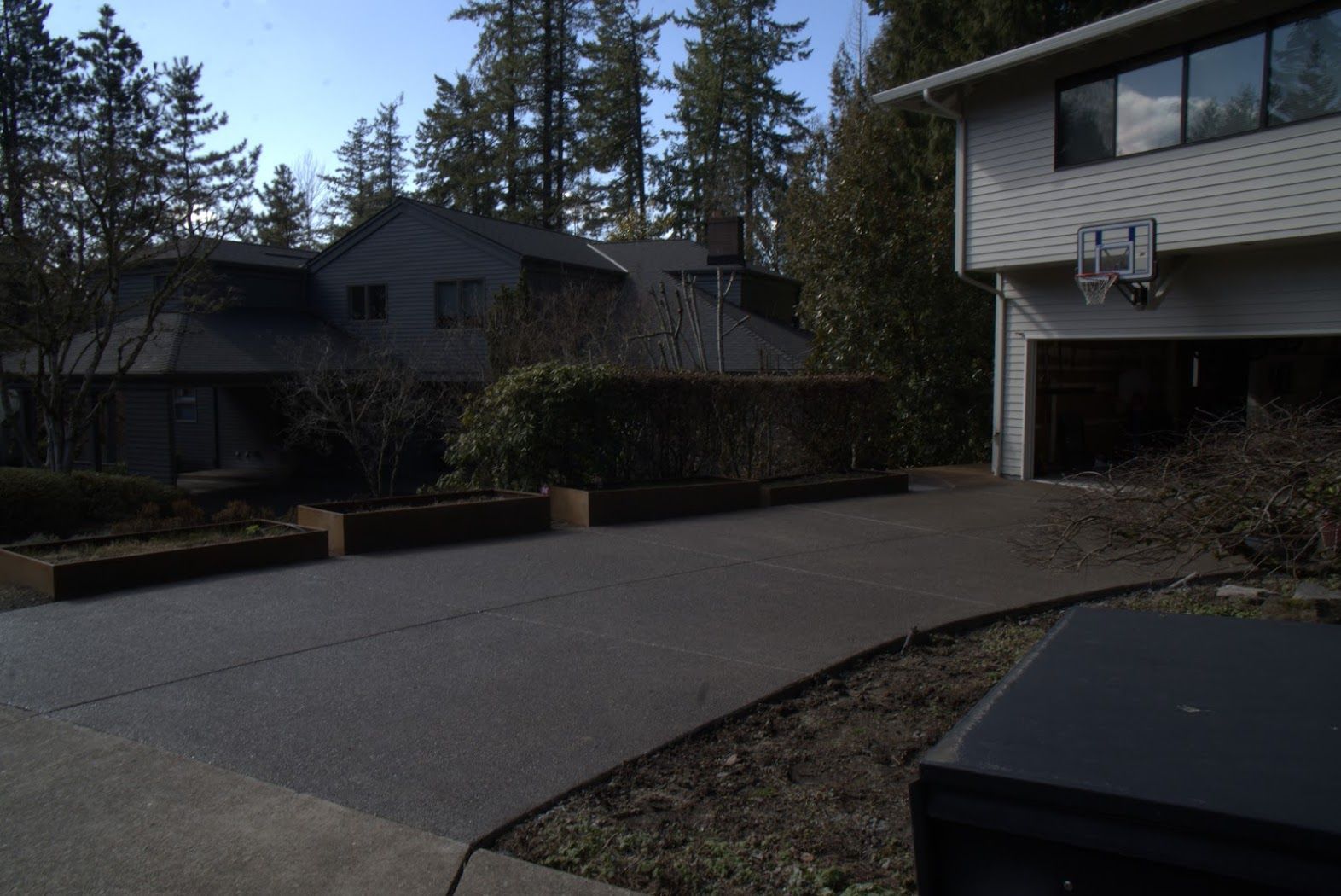 A house with a basketball hoop on the side of it