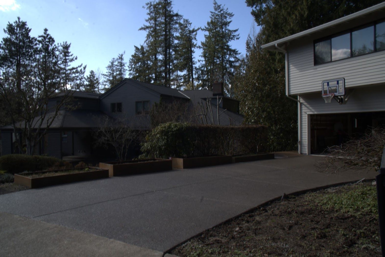 A house with a basketball hoop on the side of it