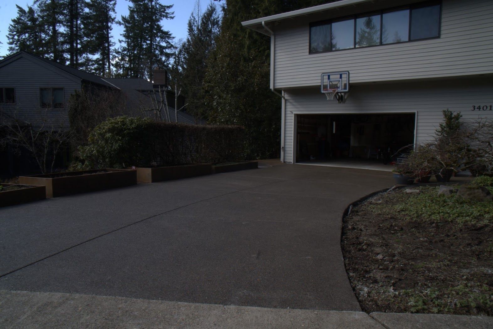 A house with a basketball hoop in front of it