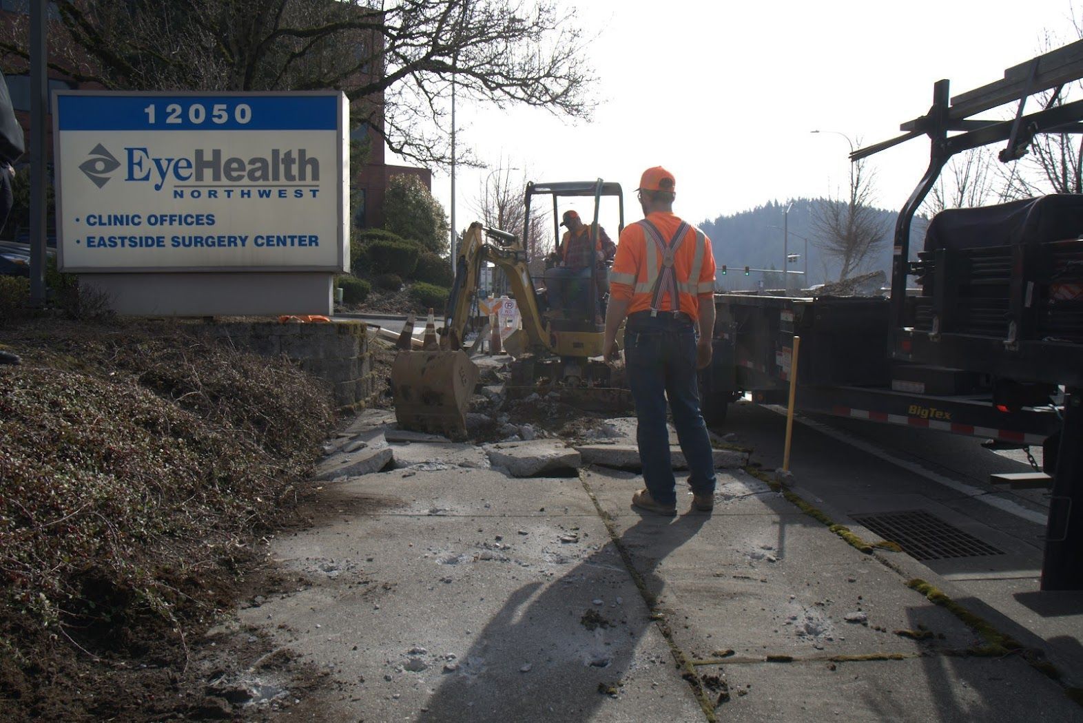 A man standing in front of a sign that says eye health