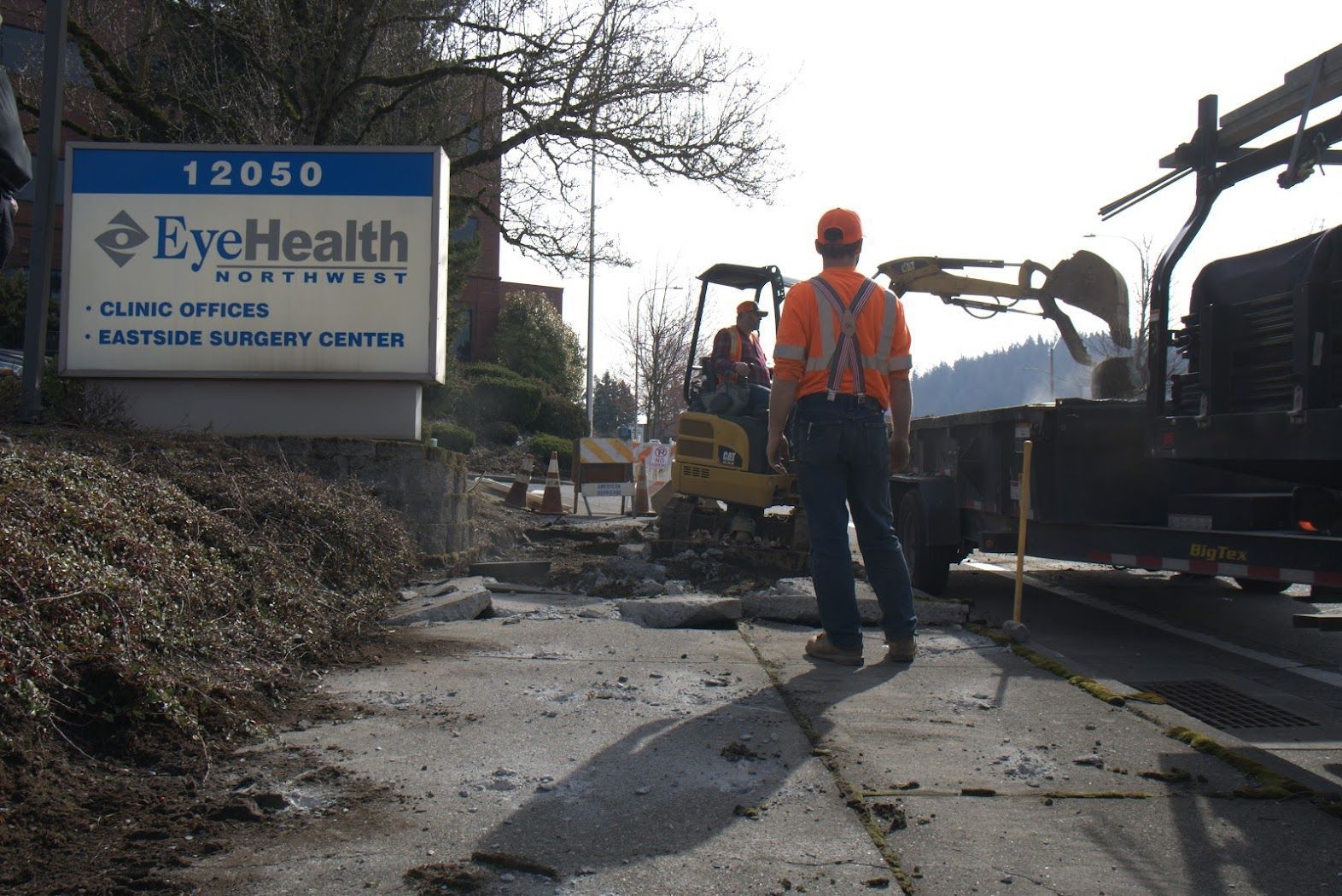 A man standing in front of a sign that says eye health
