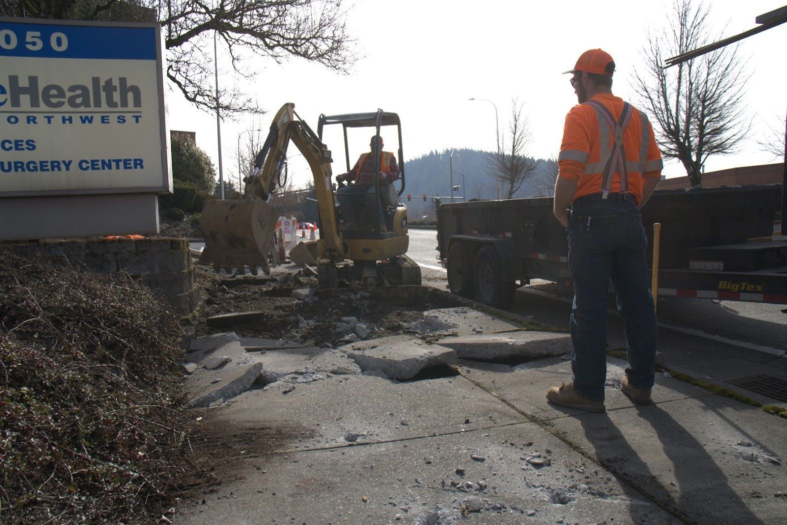 A man standing in front of a health sign