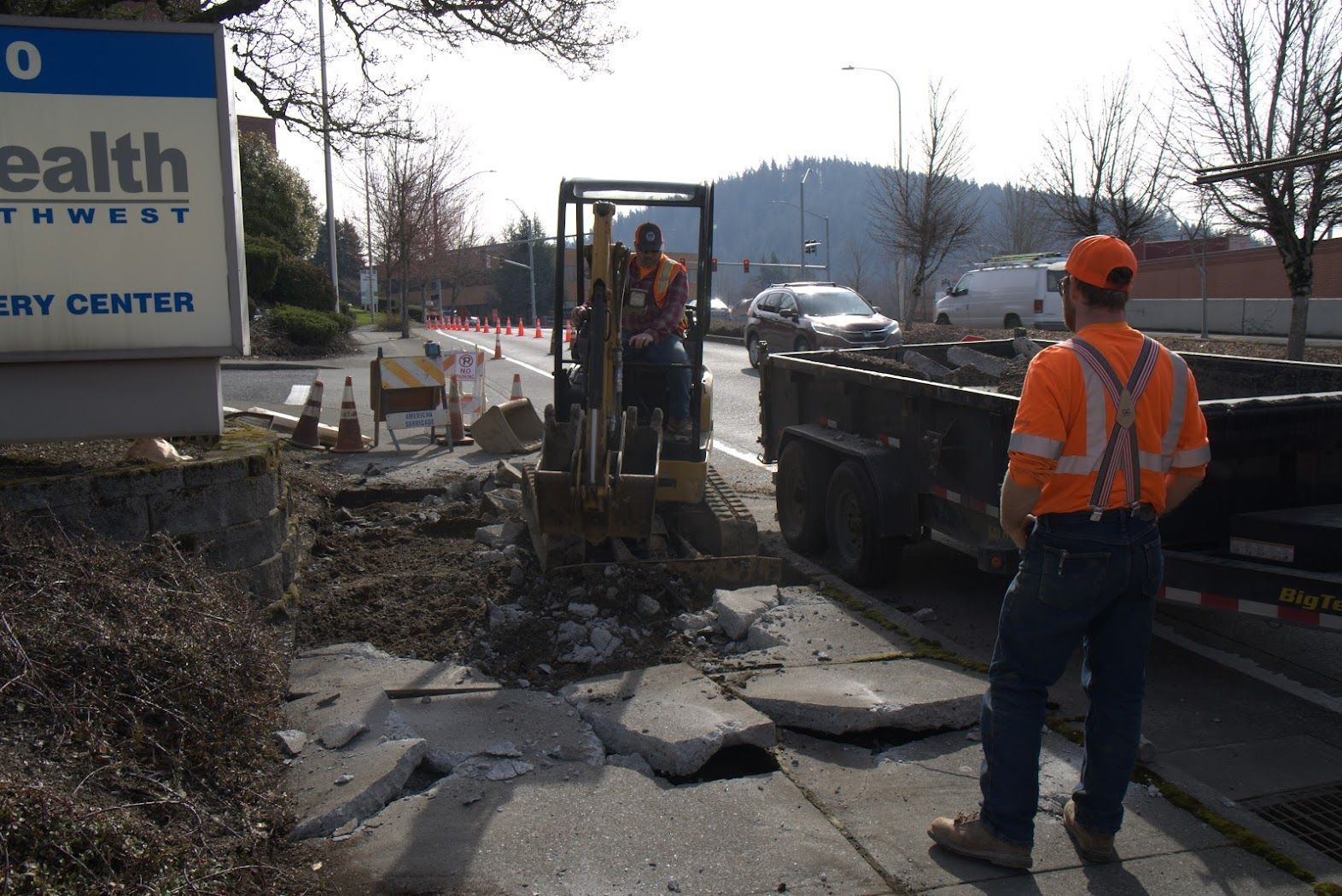A man standing in front of a sign that says health