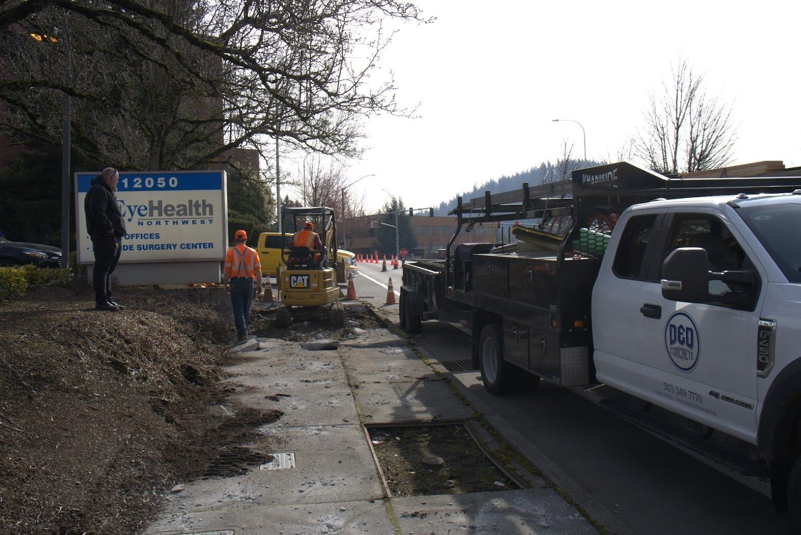 A white truck is parked on the side of the road