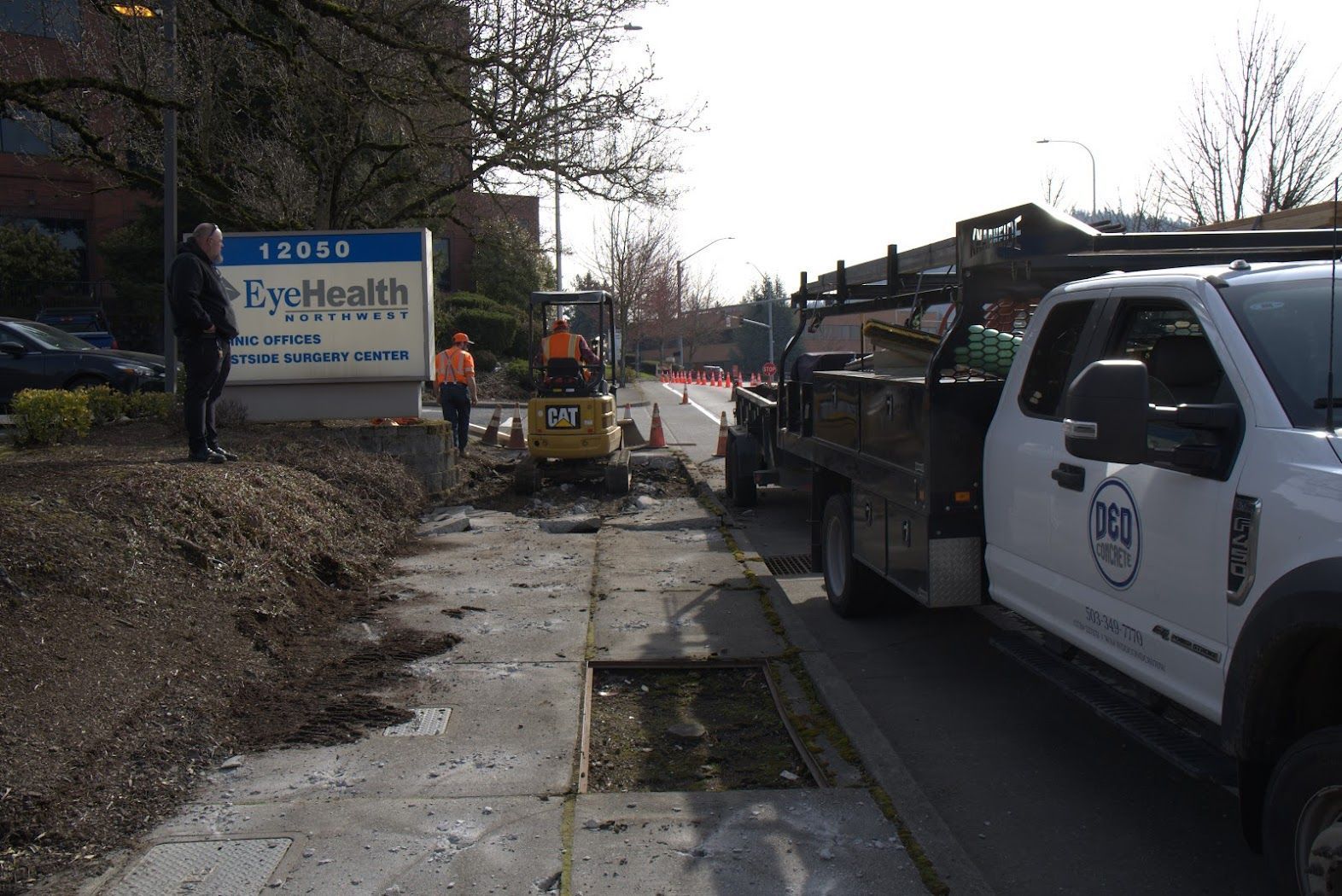 A white truck is parked on the side of the road