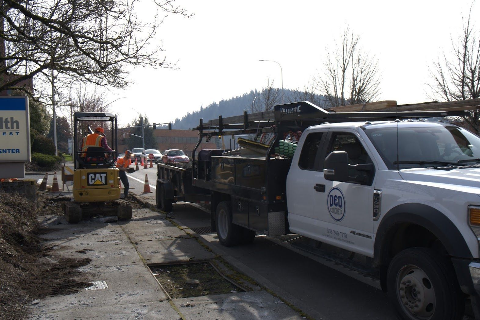 A white truck is parked on the side of the road.