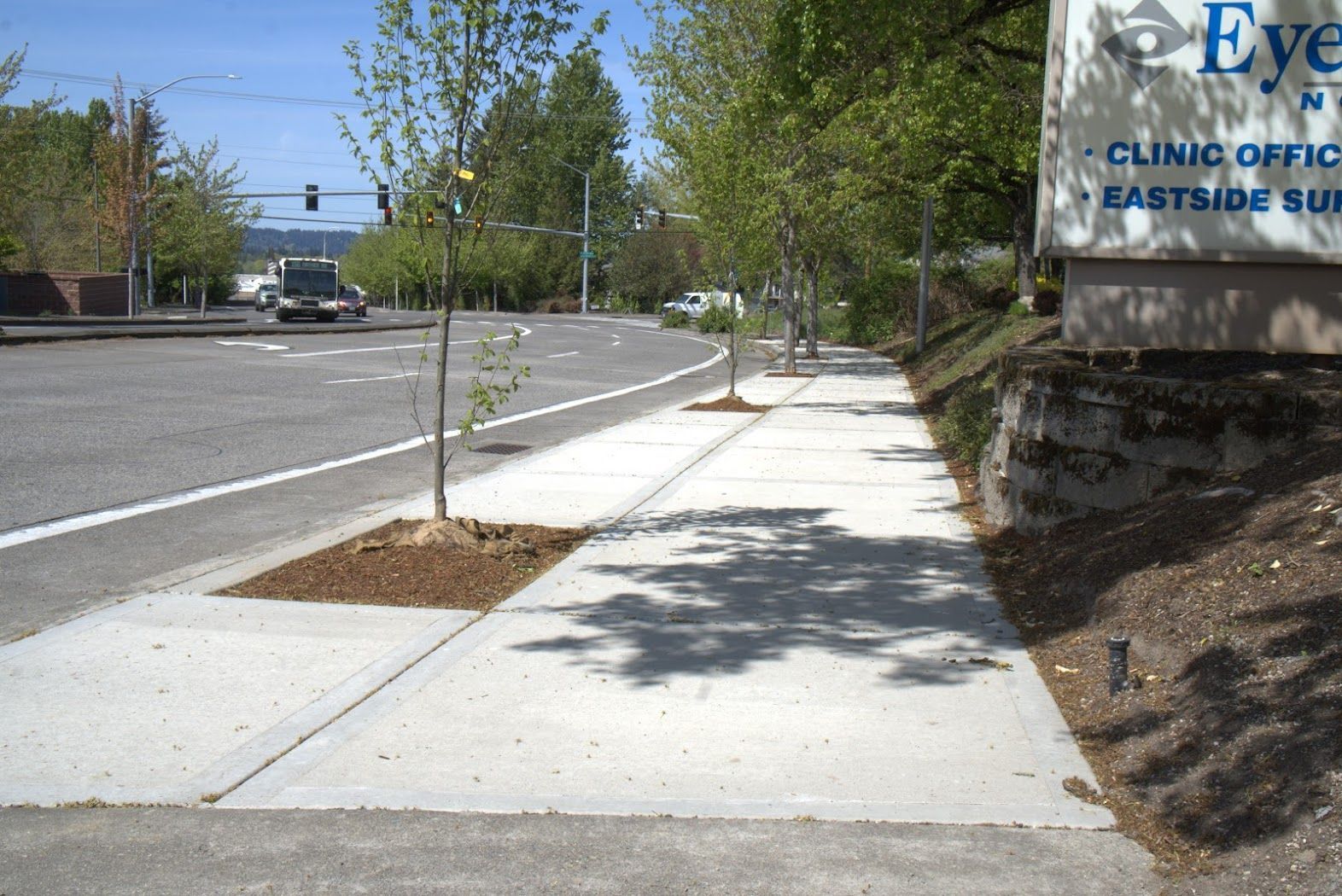 A sidewalk with a sign that says clinic of eastside eye