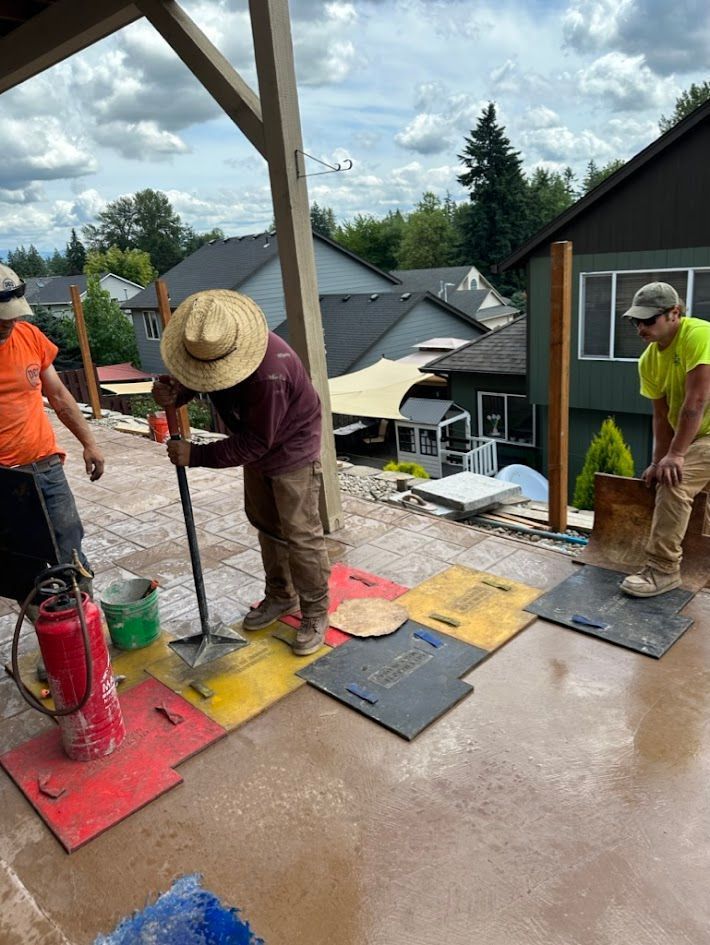A group of construction workers are working on a roof.