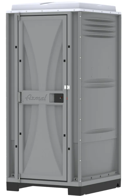 Gray portable toilet with a door in a construction setting.
