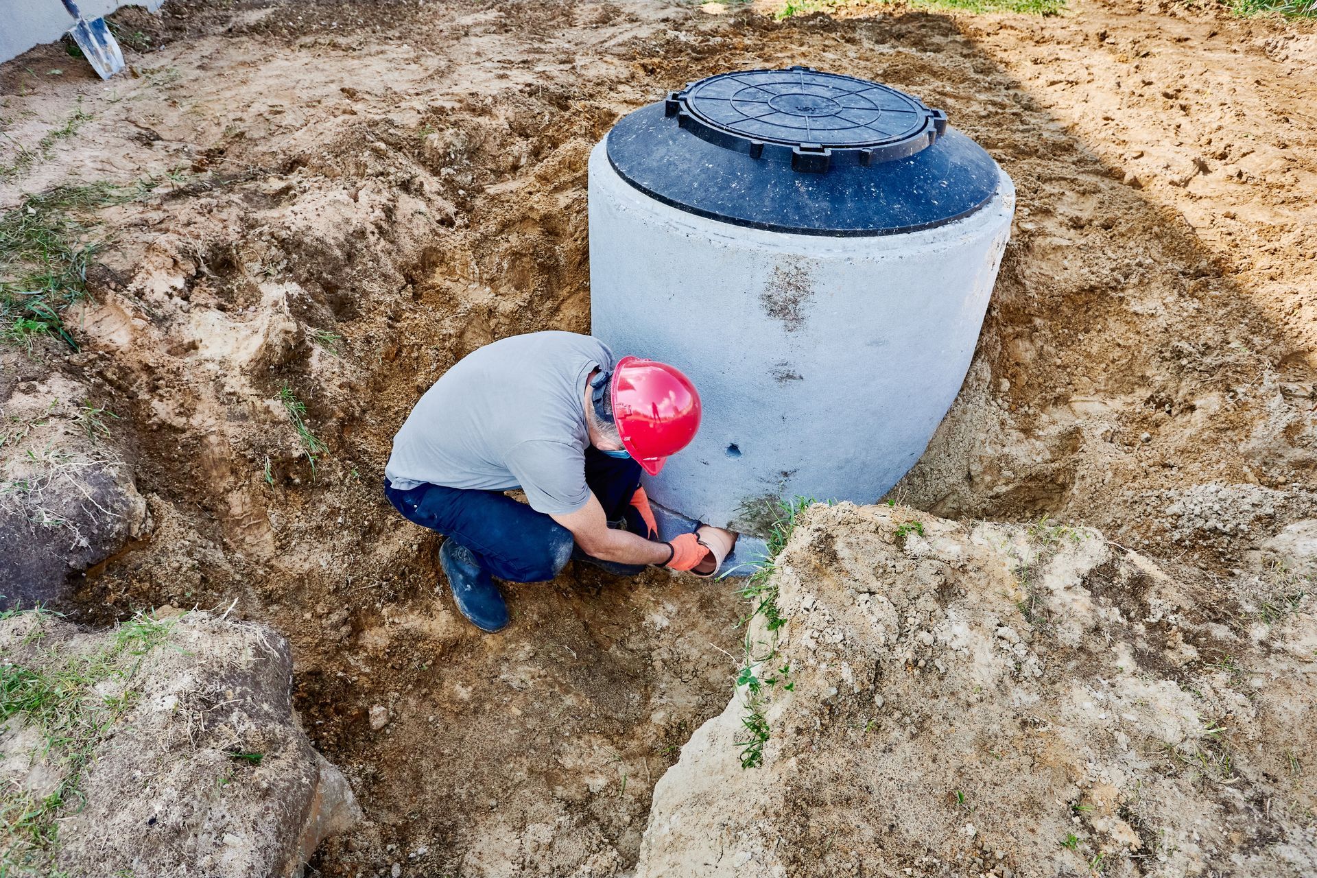 Person working on a septic tank