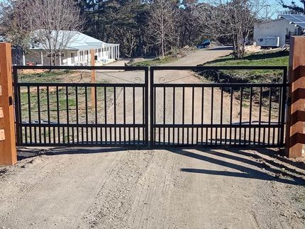 A Metal Gate is Open on a Dirt Road — Southern Gate Automation in Mittagong, NSW