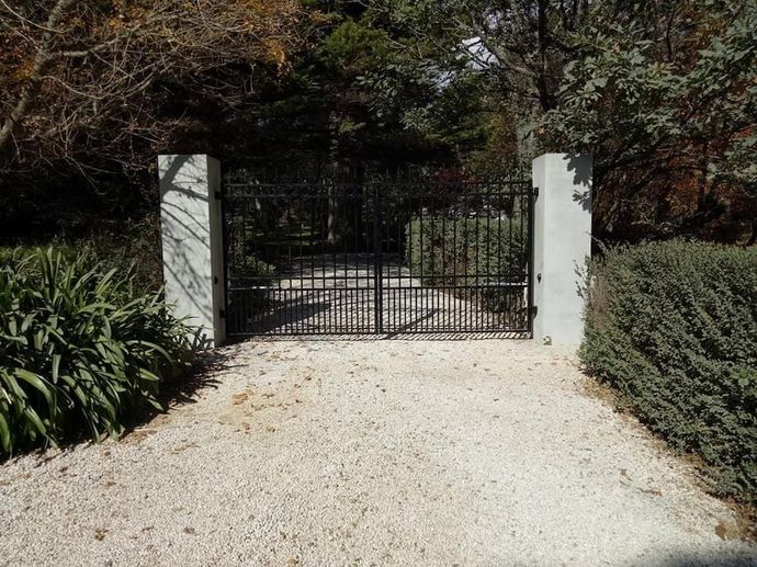 A Gravel Driveway Leading to a Gate with Trees — Southern Gate Automation in Mittagong, NSW