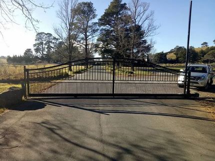 A Car is Parked in Front of a Gate on the Side of a Road — Southern Gate Automation in Mittagong, NSW