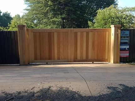 A Wooden Gate with a Black Fence — Southern Gate Automation in Mittagong, NSW