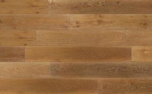 Close-up of light brown wood flooring with varying shades and grain patterns.