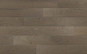 Close-up view of wooden flooring with a warm, brown-grey color and visible wood grain texture.