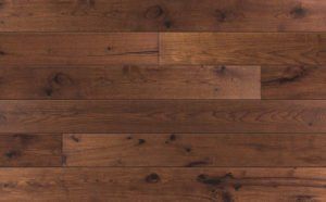 Dark stained wooden floor with natural grain and knots.