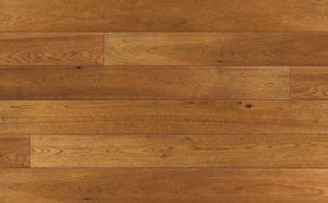 Close-up of wooden planks in shades of brown and tan, horizontally laid, for flooring.