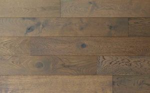 Brown wood floor with varying tones and wood grain.