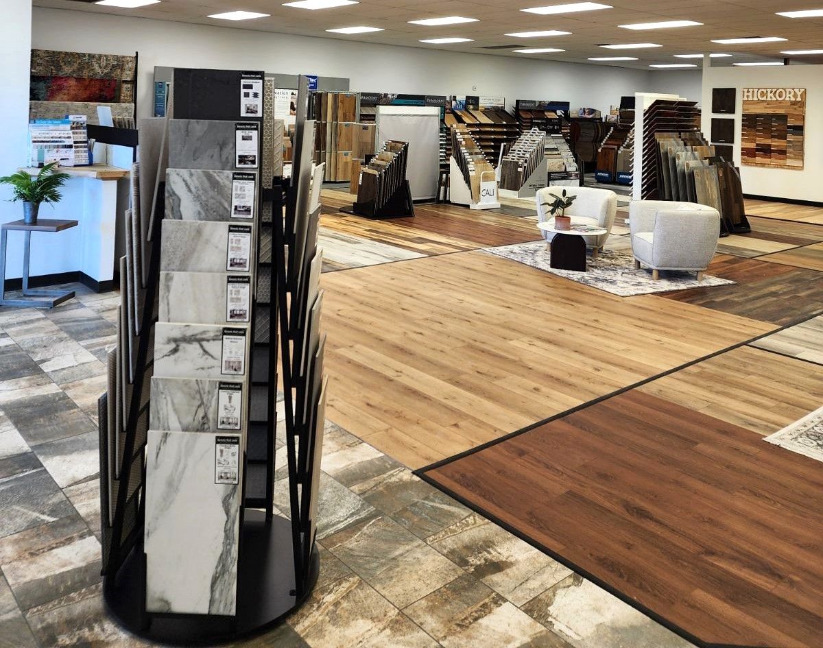 a store filled with lots of different types of flooring and tiles .