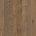 Close-up of wood floorboards in varying shades of brown.