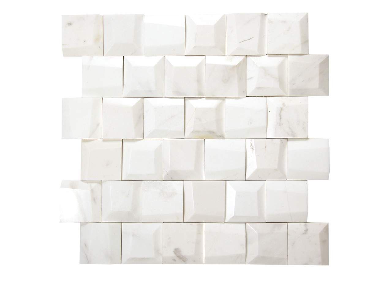 White marble tile with textured square blocks arranged in a brick pattern.