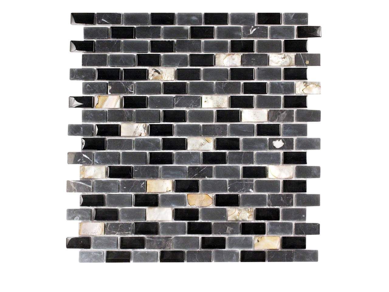 Mosaic tile with black, grey and white rectangular pieces.