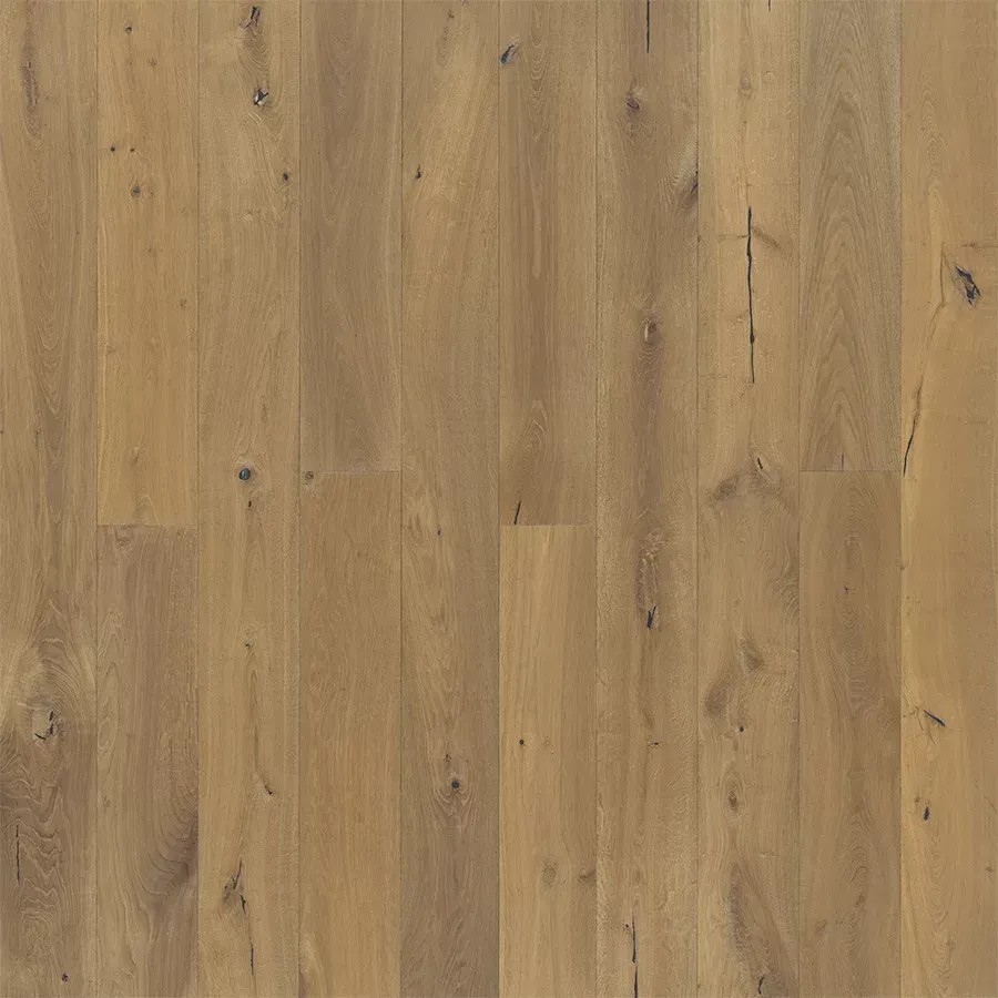 Light-brown wood flooring with various shades and natural grain patterns.