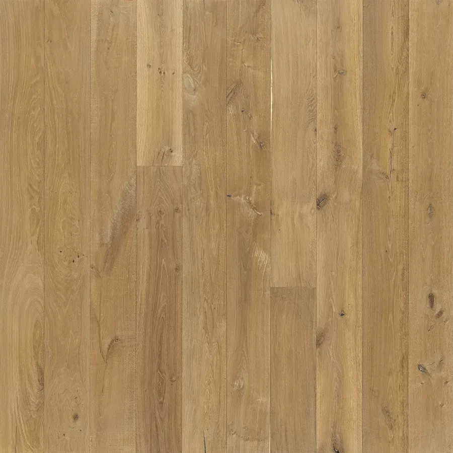 Light-colored wood flooring with visible grain and knots, arranged in vertical planks.