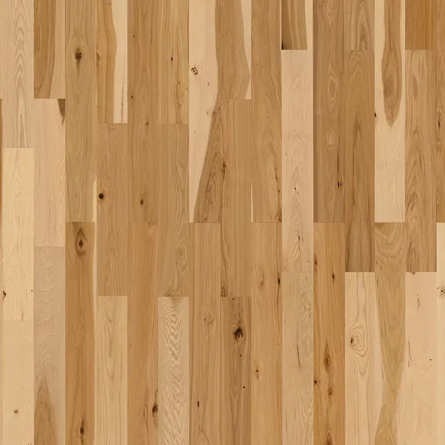 Light brown hardwood floor with vertical planks, variations in wood grain.