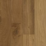 Close-up of light brown hardwood flooring with visible wood grain.