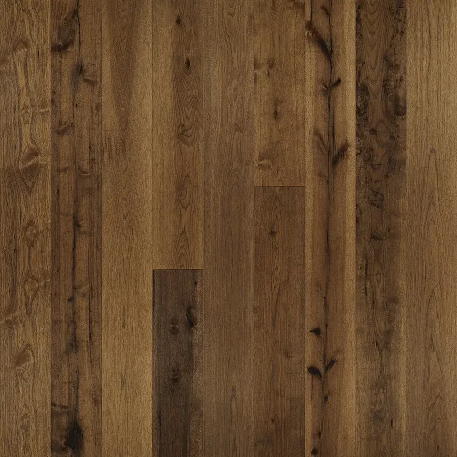 Dark brown wood floor planks with visible grain and knots.