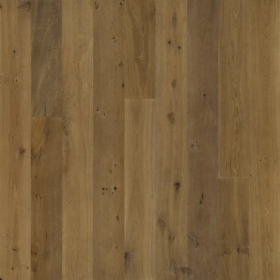 Close-up of light brown wooden floor planks with visible grain and knots.
