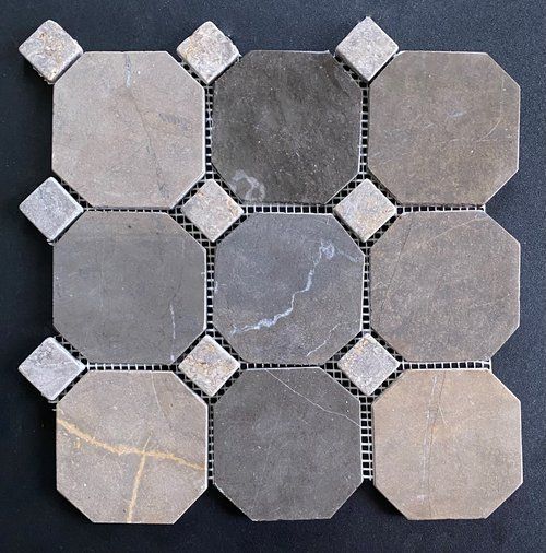 Mosaic tile with octagonal and square shapes in shades of gray and beige.