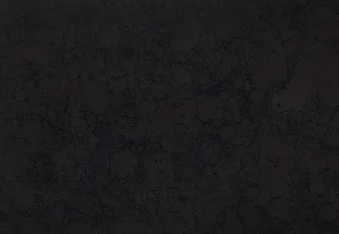 Dark, textured surface with subtle, lighter veining, reminiscent of stone or concrete.